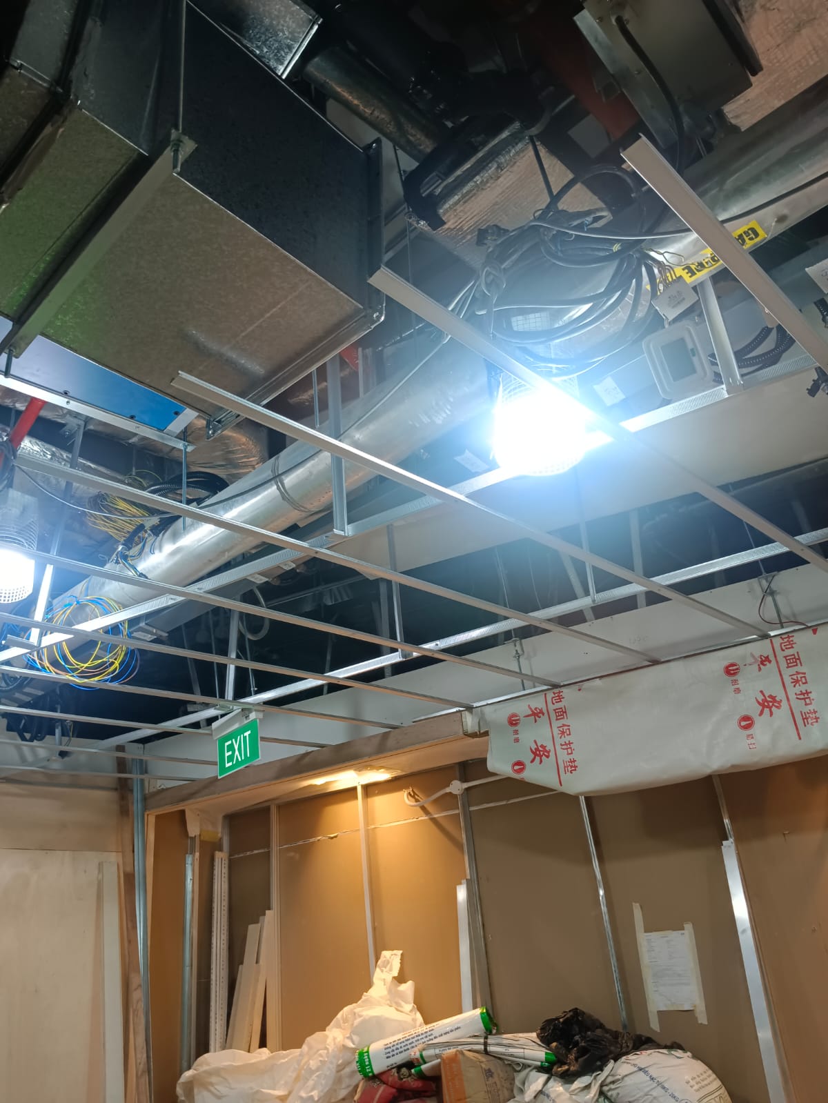 AR Ceiling Partition Singapore — ceiling grid and MEP coordination above a suspended ceiling | Ceiling Partition Singapore