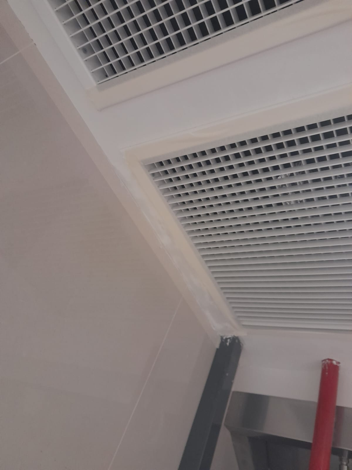 AR Engineering Ceiling Partition Singapore — suspended ceiling tile installation in a commercial unit